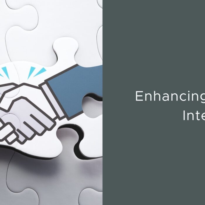Homepage 19 Illustration of a handshake inside interlocking puzzle pieces representing partnership and enhancing energy intelligence